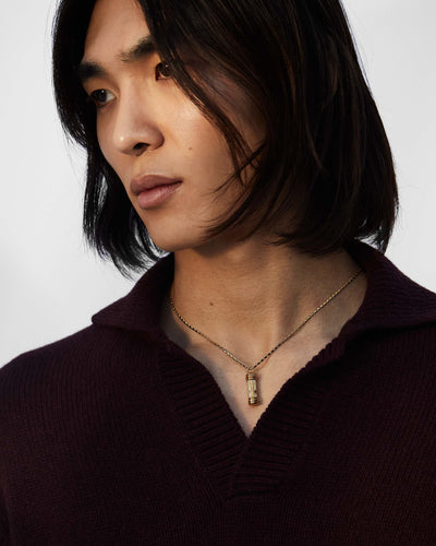 model wearing Alighieri men's jewellery gold plated chain necklace