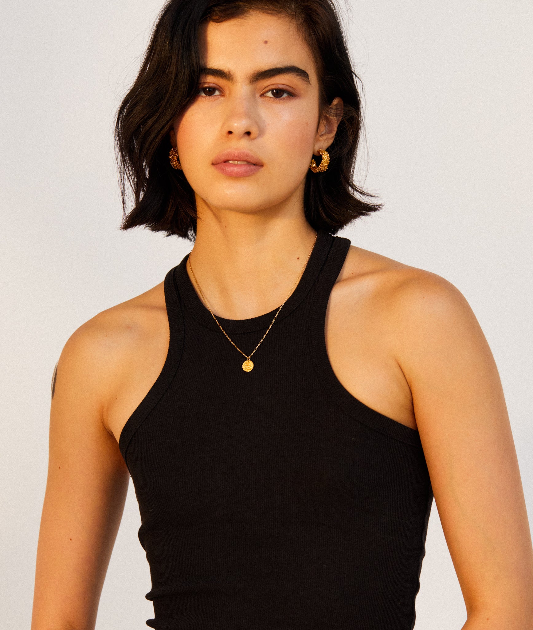 Model wearing Alighieri Baby Lion Cub Leone Necklace