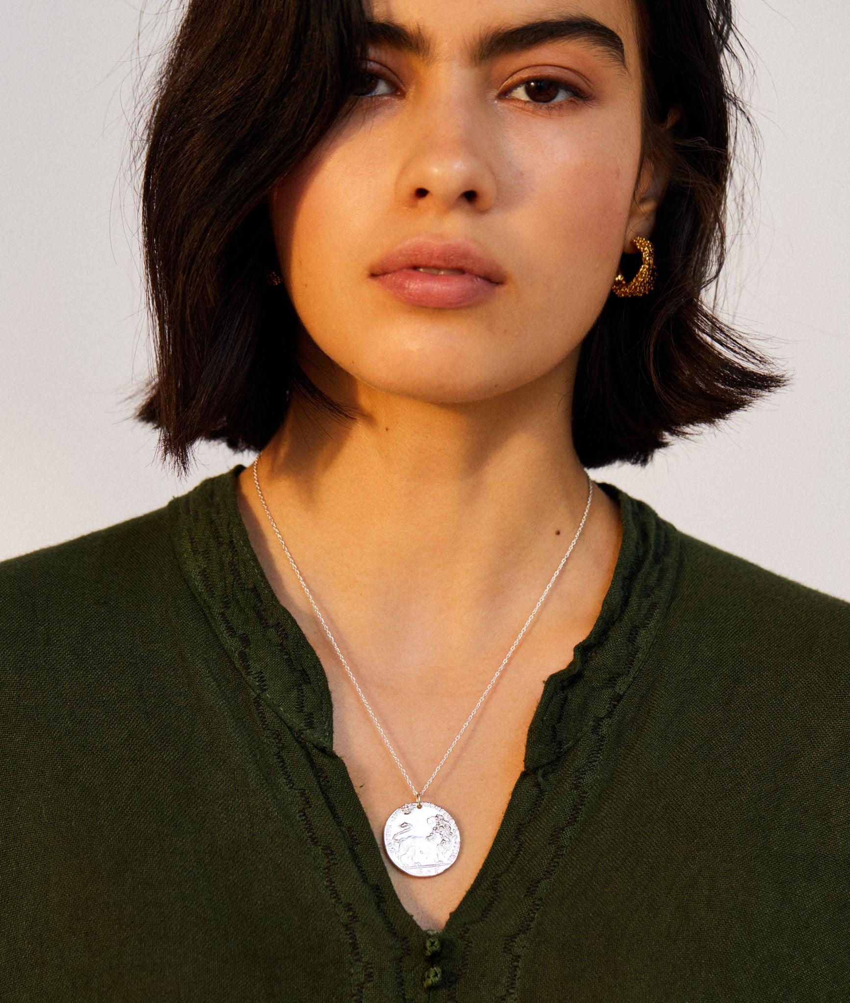 Model wearing Alighieri Silver Snow Lion Leone Medallion Necklace Venetian Coin