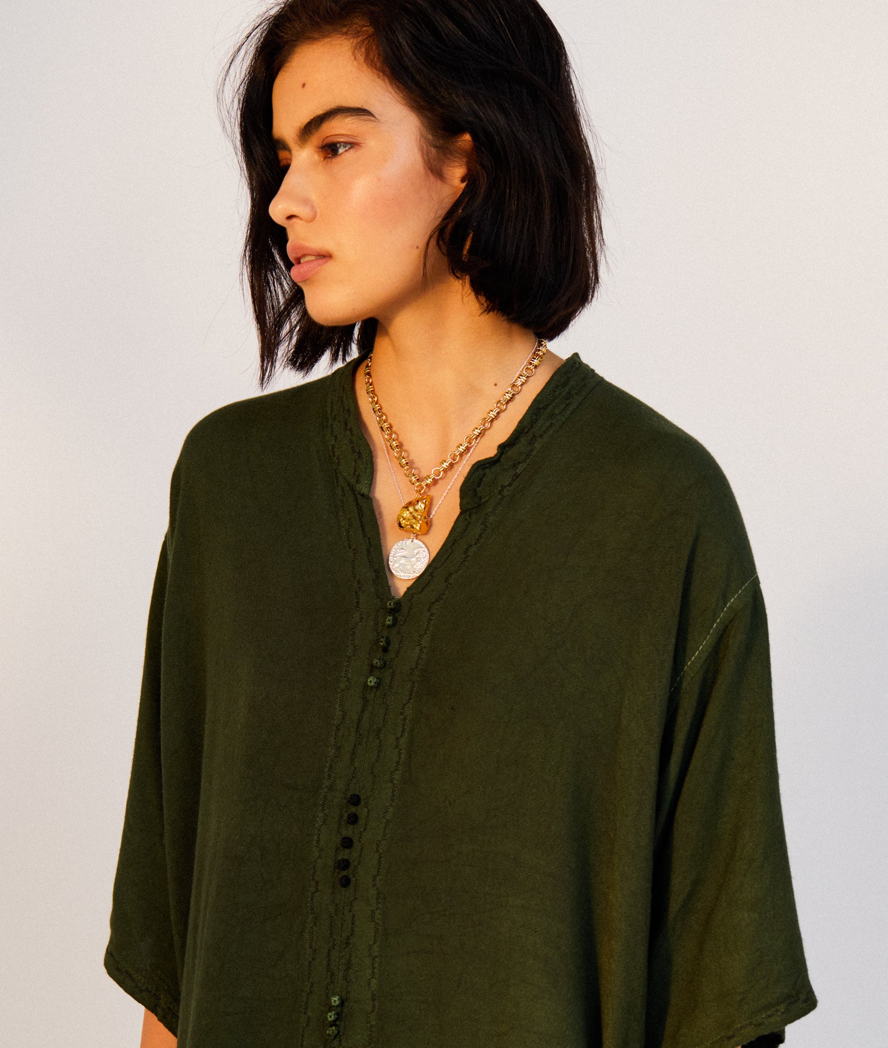 Model wearing Alighieri Silver Snow Lion Leone Medallion Necklace Venetian Coin Layering