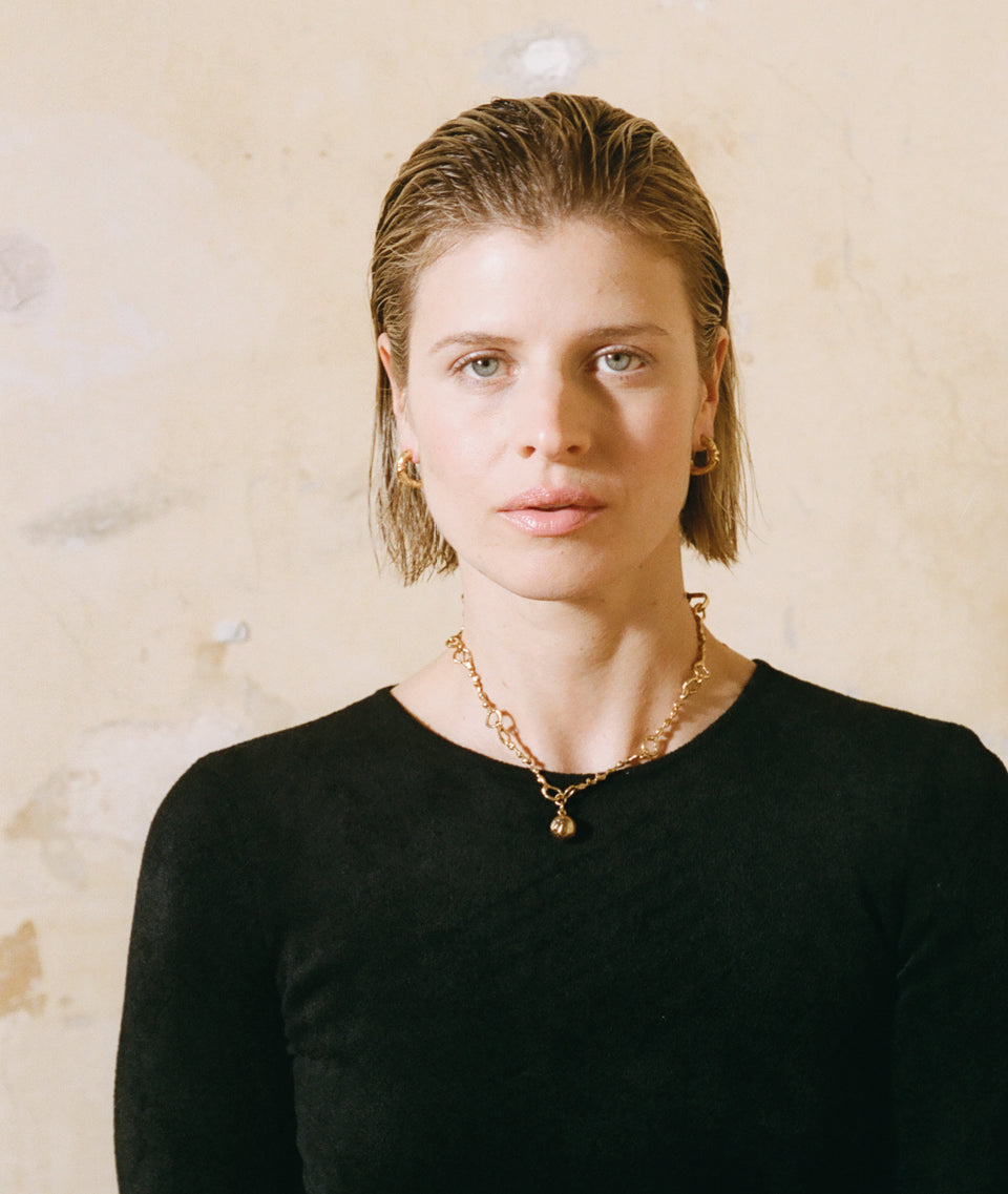 Model wearing Alighieri Gold Necklace Ball of Curiosity