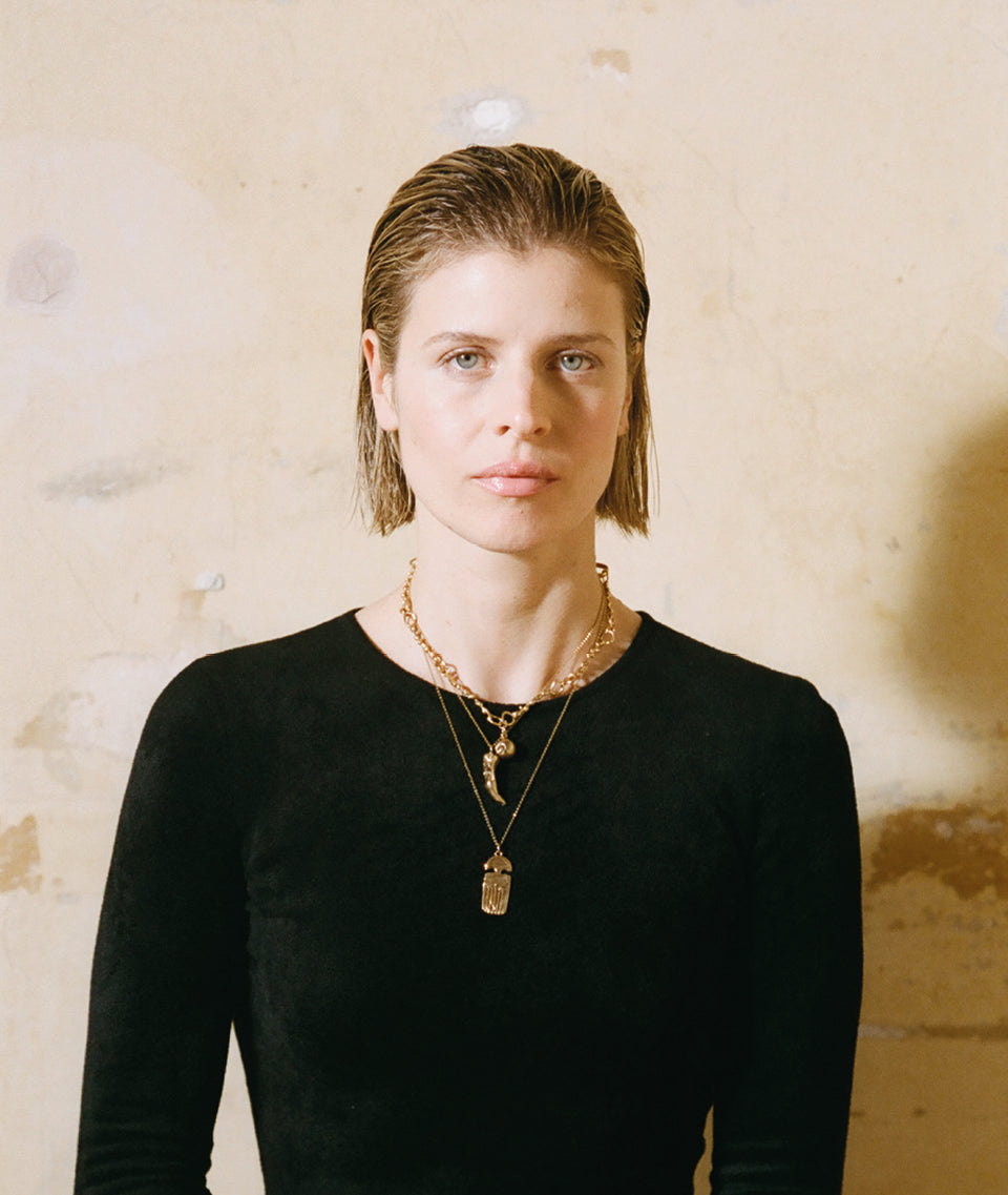 Model wearing Alighieri Gold Necklace Feline Majesty layered