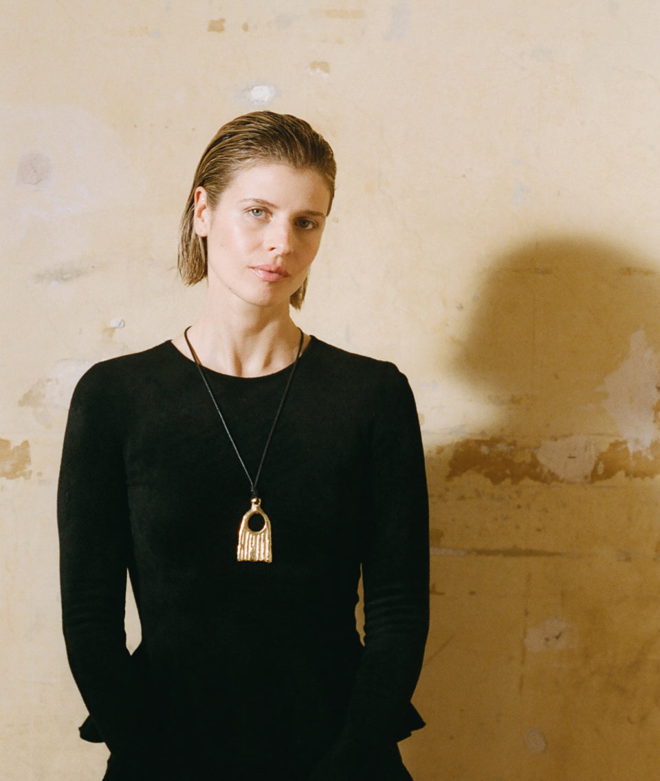 Model wearing Alighieri Gold Necklace VANITAS