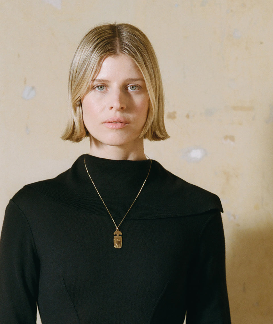 Model wearing Alighieri Gold Necklace Vanity Comb