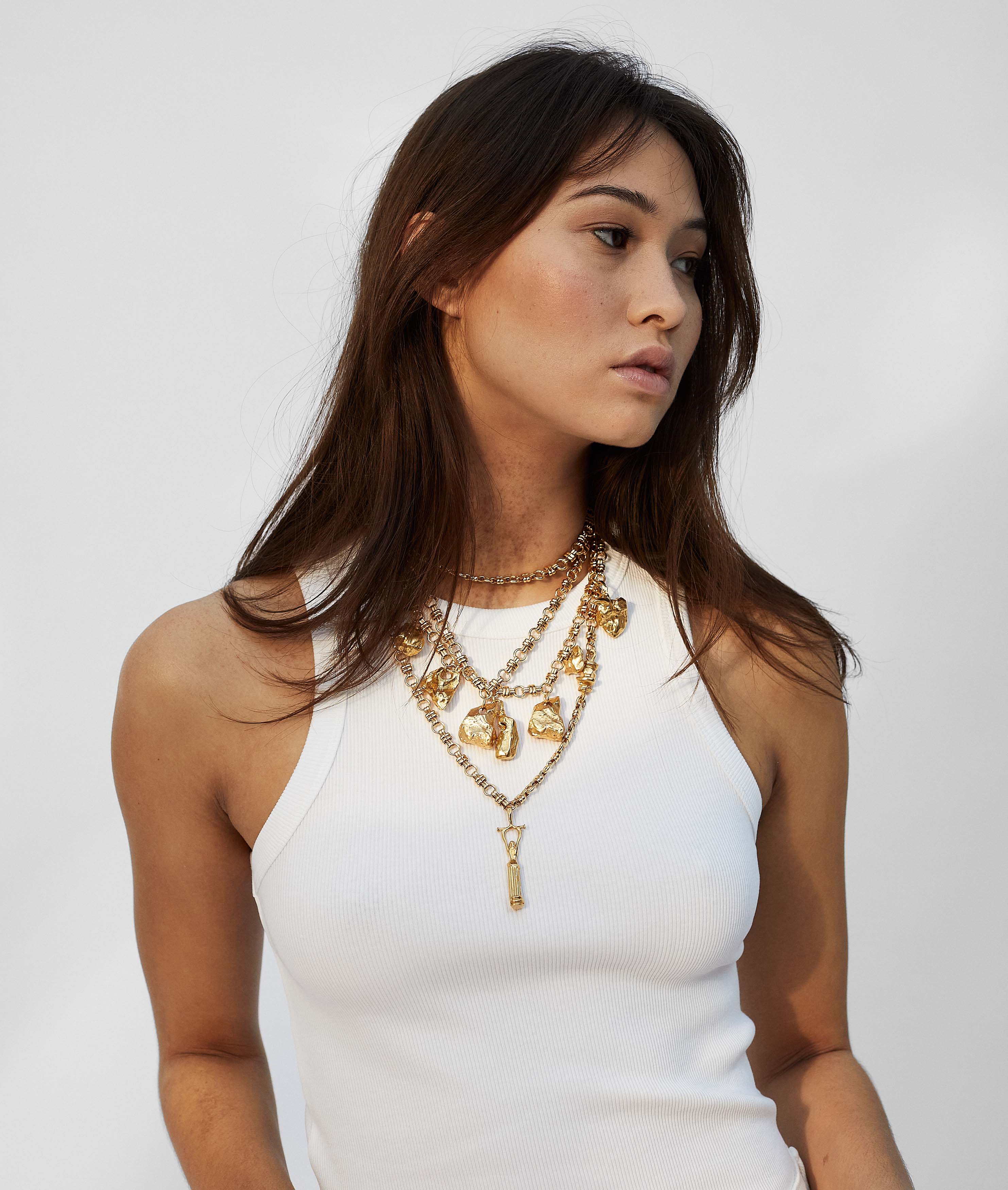 Model wearing Alighieri Chunky Chain necklace with chunky talismans layering