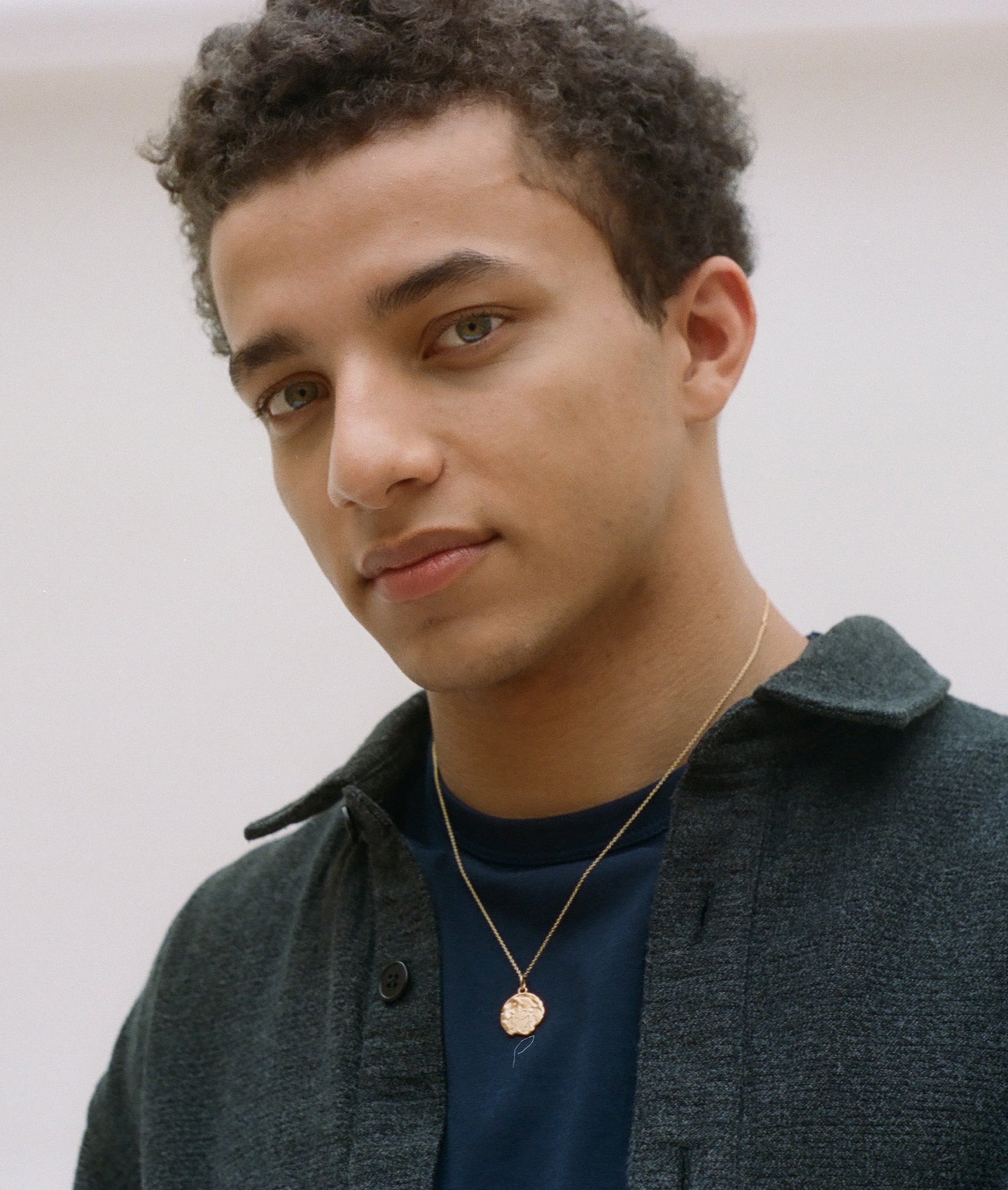 model wearing Alighieri Gold Gemini Zodiac Necklace Medallion