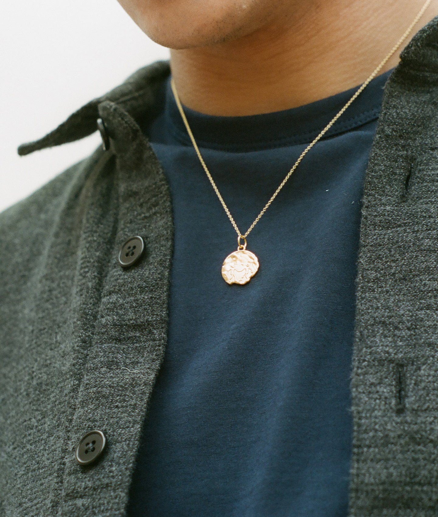 Model Wearing Alighieri Gold Gemini Zodiac Necklace Medallion