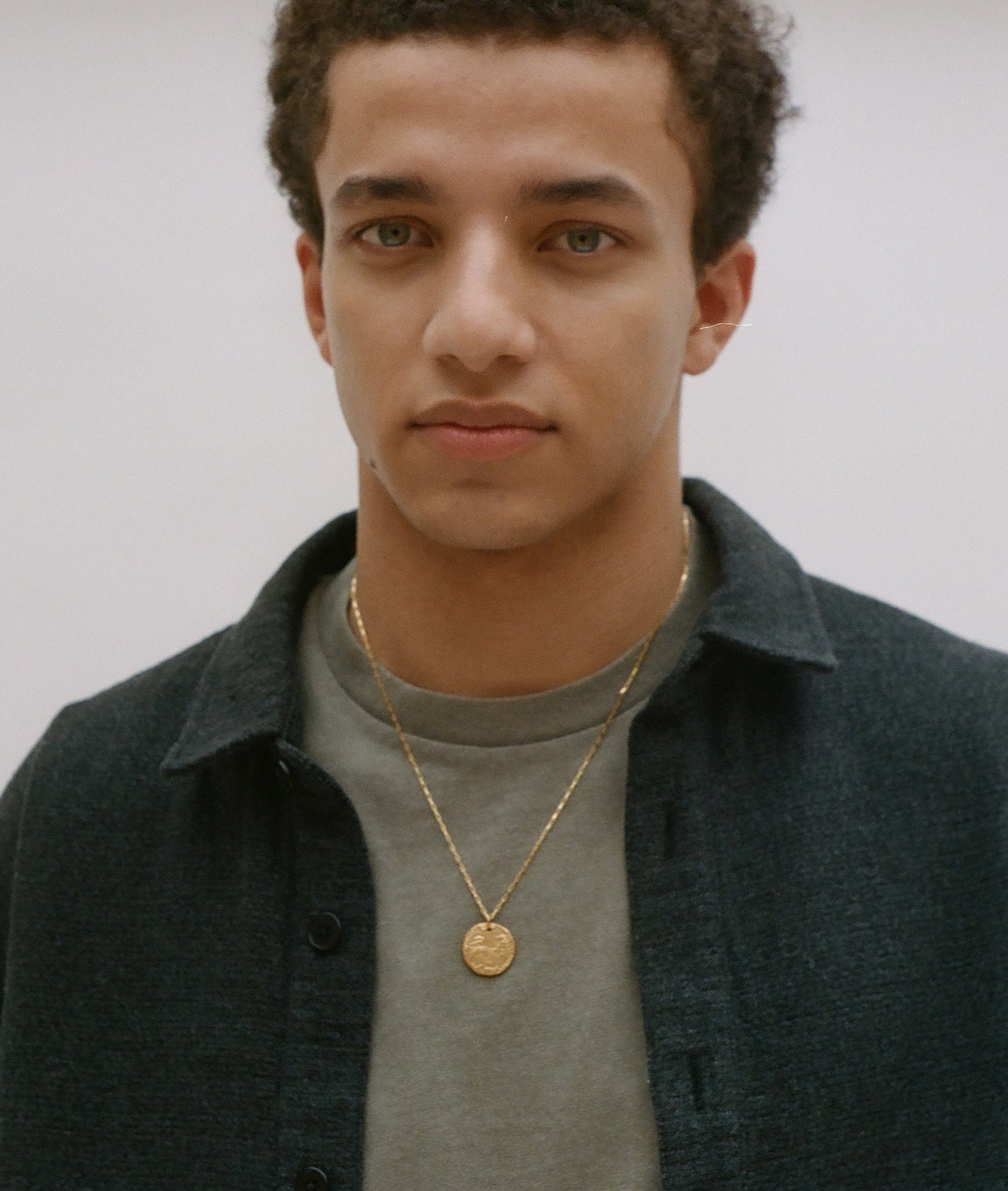 model wearing Alighieri signature gold leone medallion medium coin necklace box chain