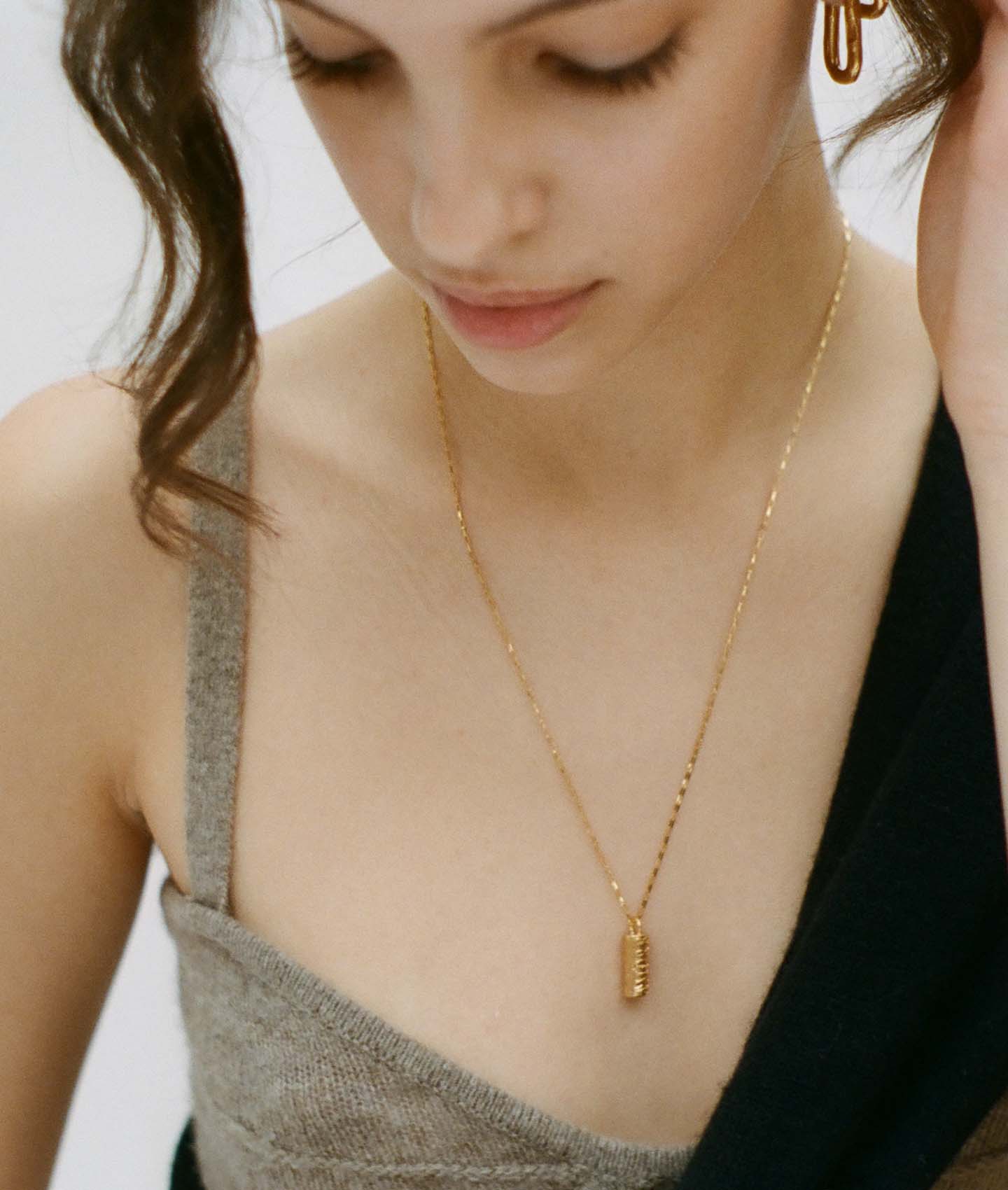 Model wearing Alighieri Box Chain Amore Pendant Necklace