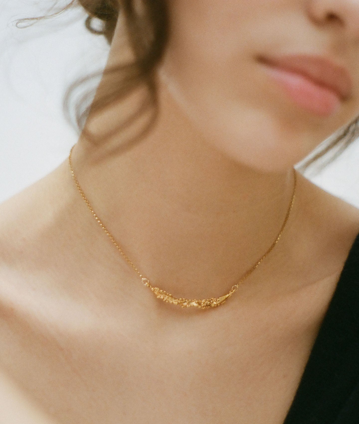 Model wearing Alighieri Bewitching Constellation Gold Bar Necklace