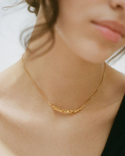 Model wearing Alighieri Bewitching Constellation Gold Bar Necklace