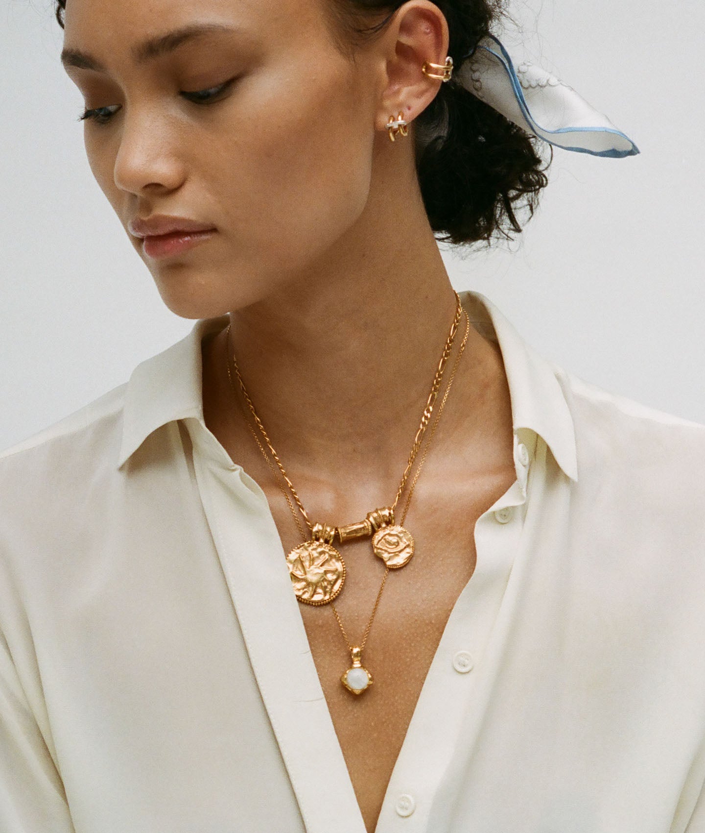 Model wearing Alighieri Eye of the Moonstone Gold Pendant Necklace layering