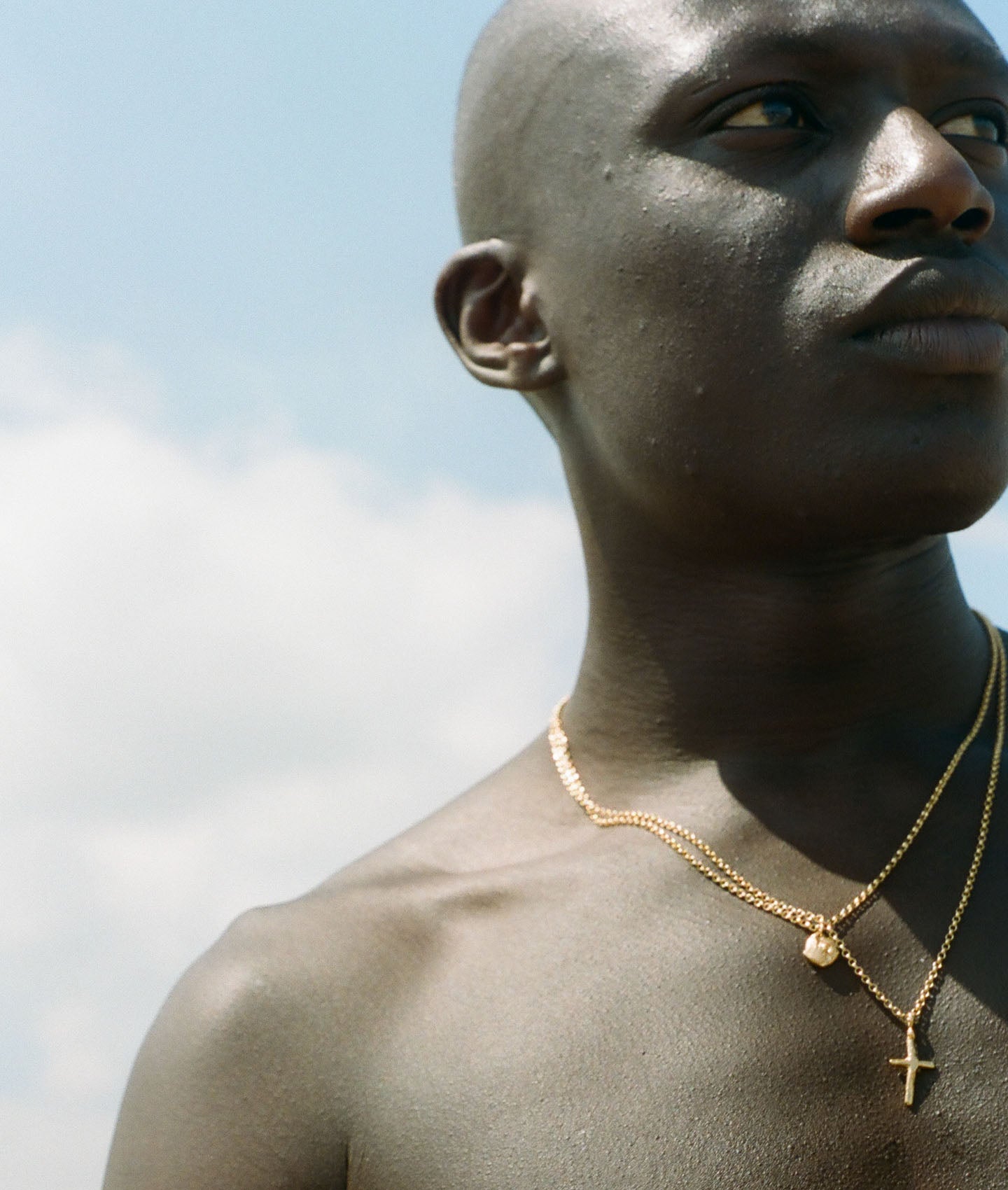 model wearing alighieri men's jewellery cross talisman necklace chain